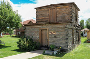 A wooden building with a sign on the door. AI generated content